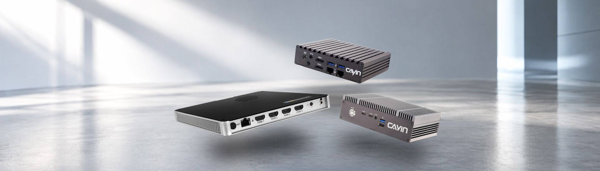 Three CAYIN SMP digital signage players showing their HDMI, USB and network ports
